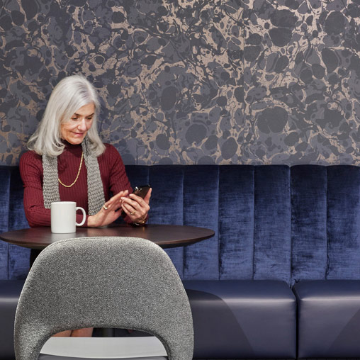 A woman sitting at a table.
