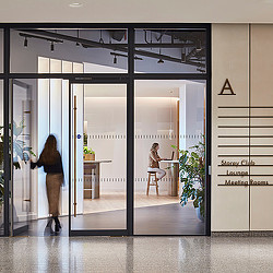 Woman walking into Storey Club entrance