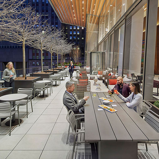 People sitting at tables in a restaurant.