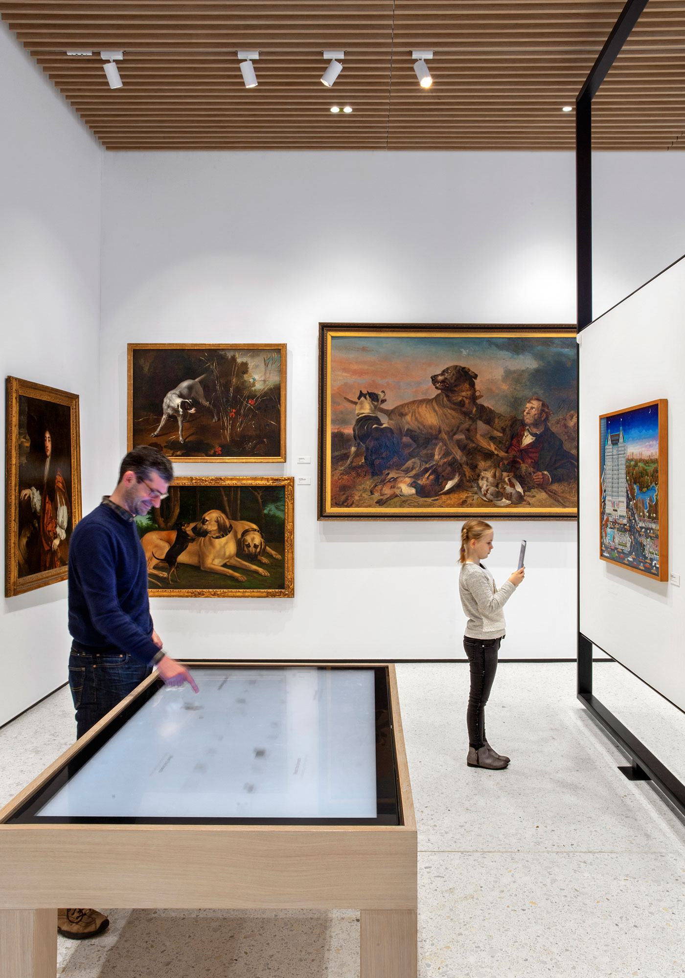 Museum visitors engage with interactive exhibits.