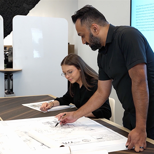 2 Gensler employees working on a design