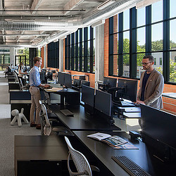 Men standing in an office.