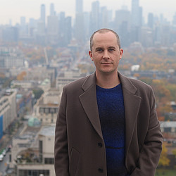 Steven Paynter with cityscape background. Credit: Parambir Singh | Business Insider.