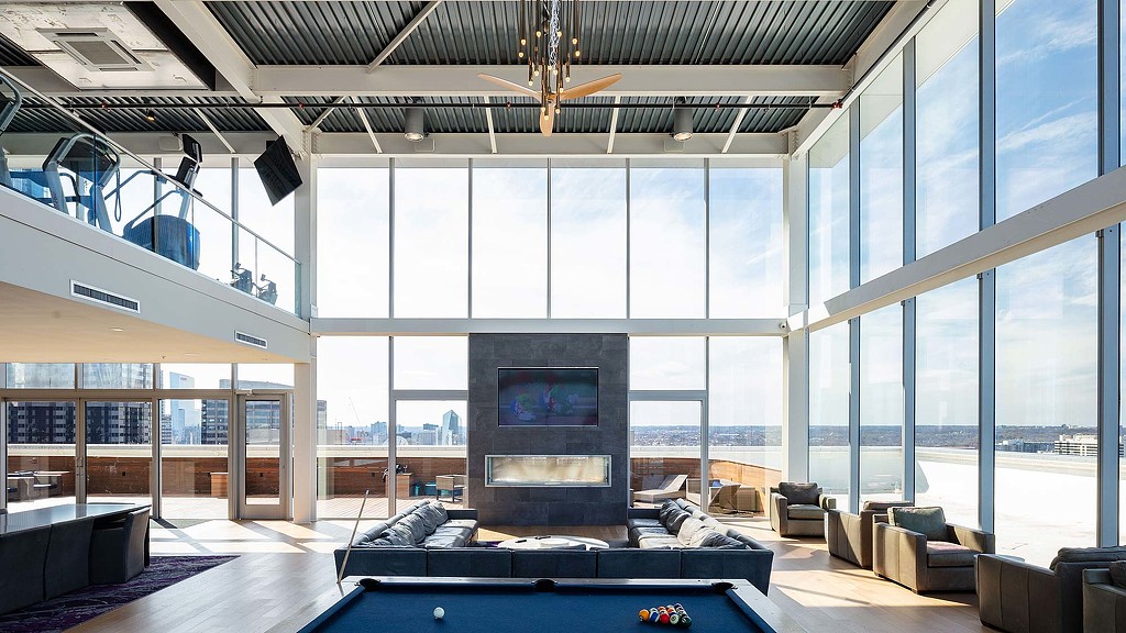 One Franklin Tower indoor amenity space with gym
