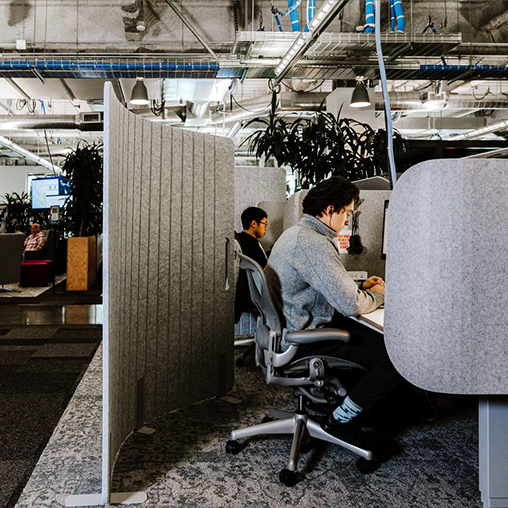 Meta noise reduction cubes at work stations.