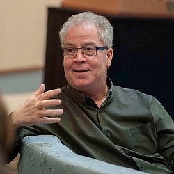 Bob Weis sitting and telling a story