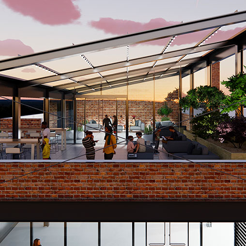A group of people sitting on a patio with a glass wall and a building with a glass roof.