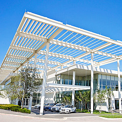 A building with cars parked outside.