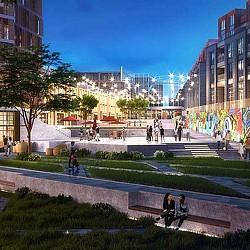 A group of people walking around a park with buildings in the background.