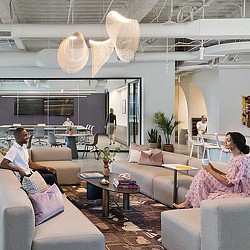 A group of people sitting in a living room.