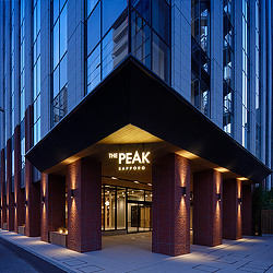 The Peak Sapporo office building exterior at night