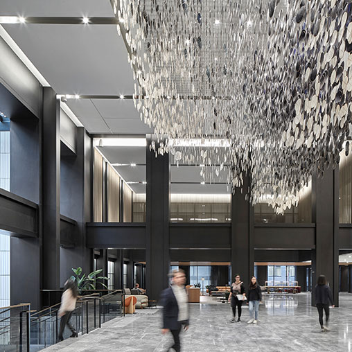 People walking inside Willis Tower lobby