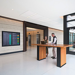 Travis County Civil and Family Courts waiting area with digital screen