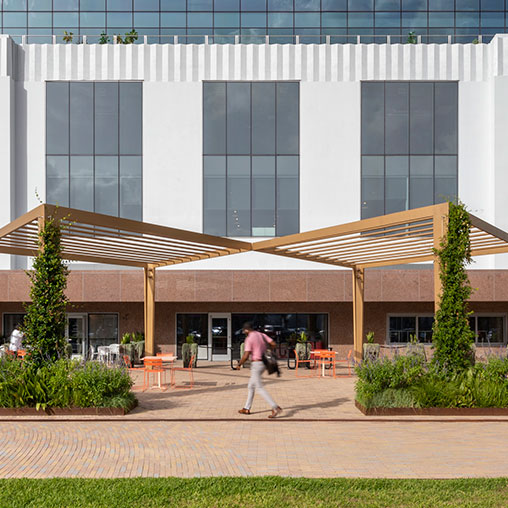 A person walking outside of a building.
