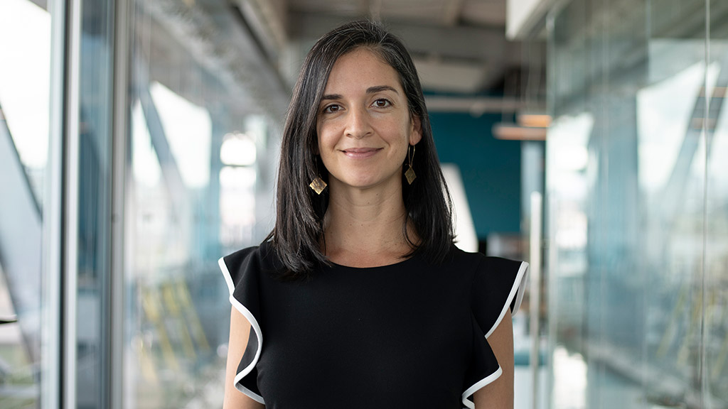 A woman smiling for the camera.