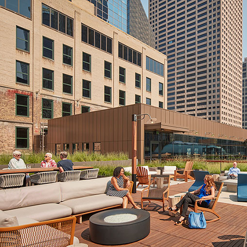 A group of people sitting outside.
