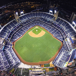 A large stadium with a green field.