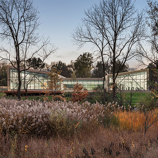 A building with trees and grass.