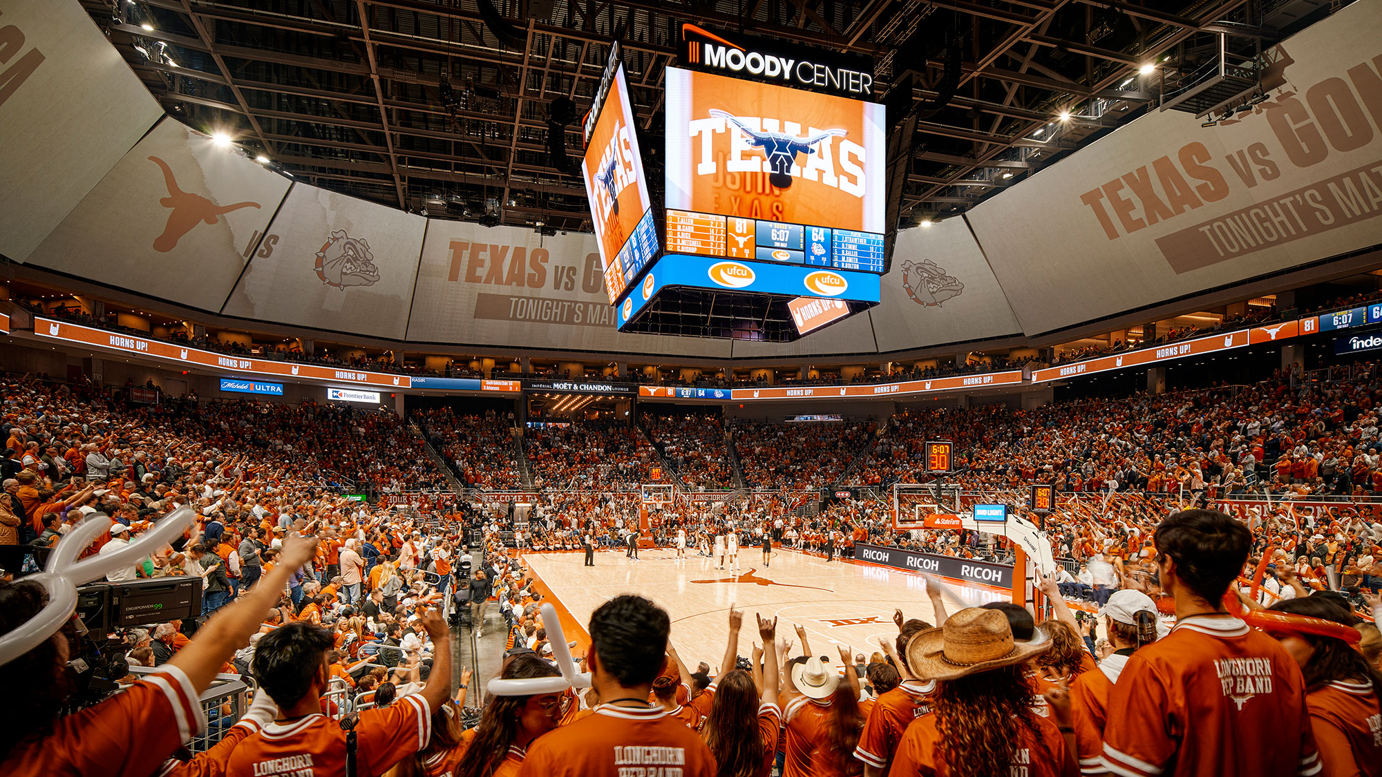 A crowd of people in a stadium.