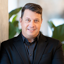 A man smiling for the camera.