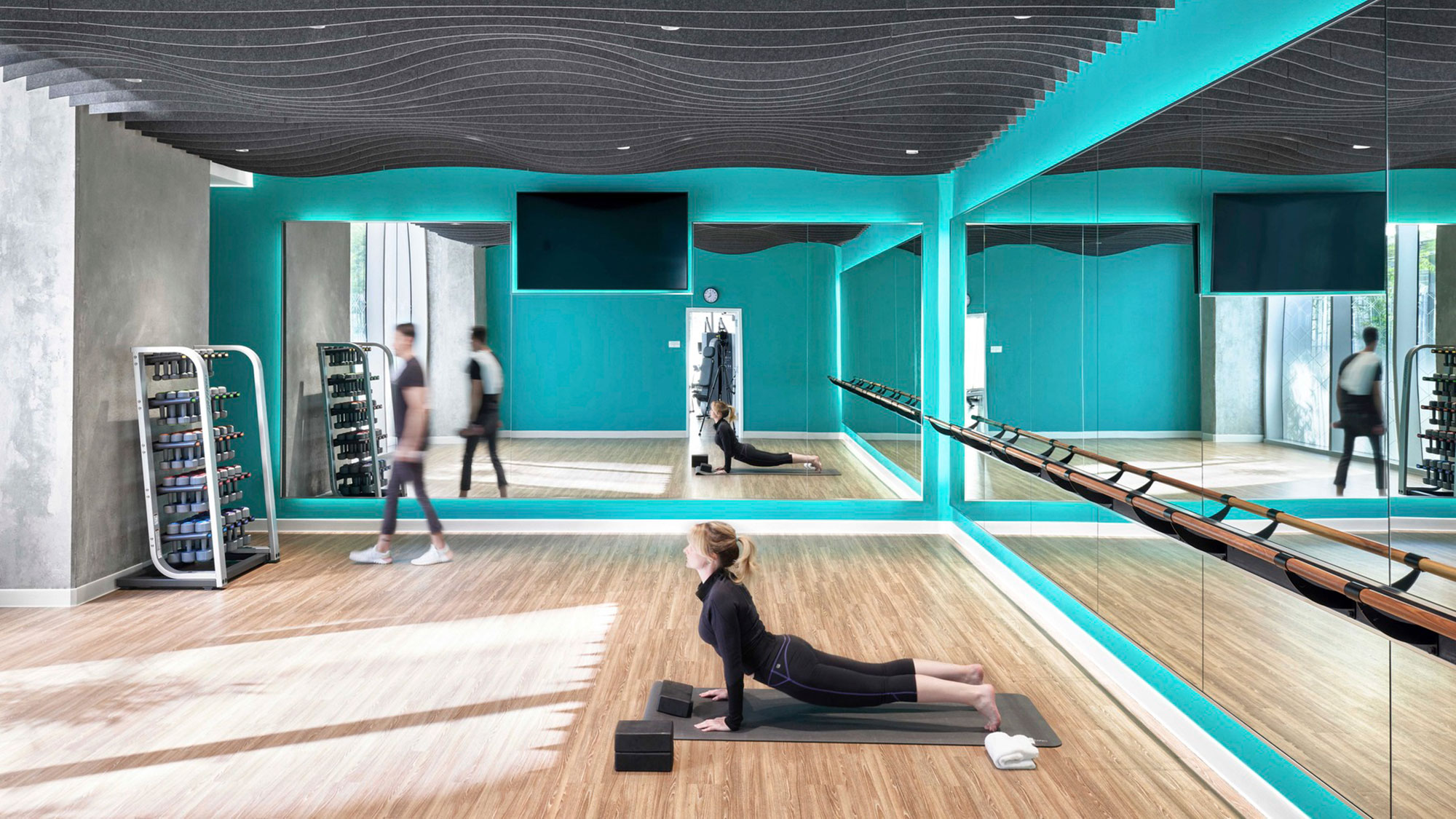 A group of people exercising in a gym.