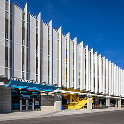 A building with a blue awning.