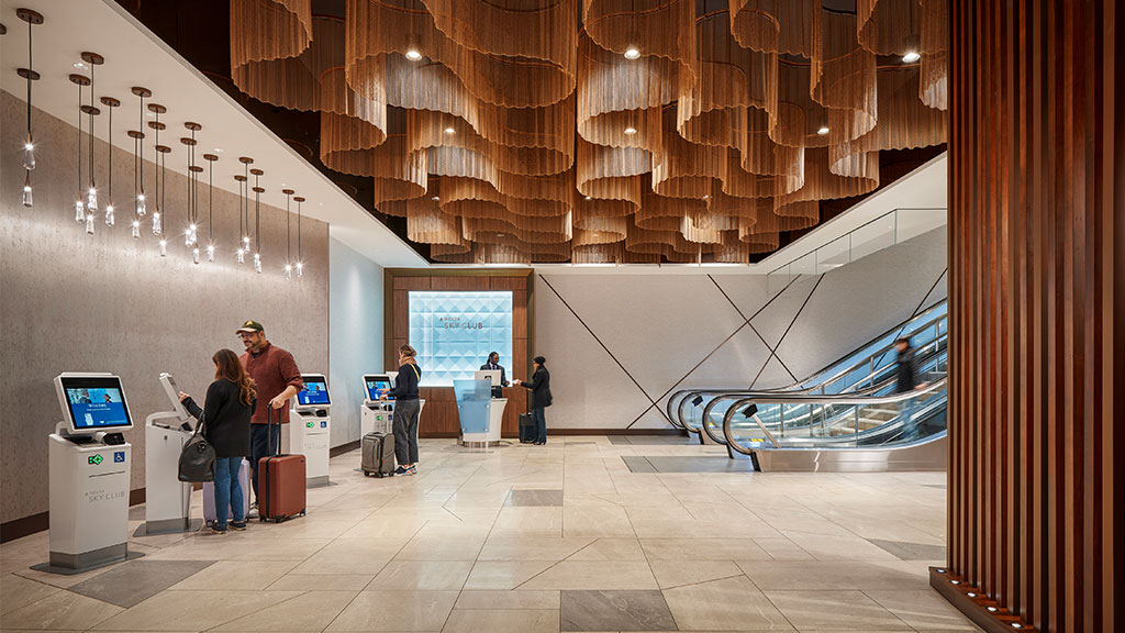 LAX T2 Delta Sky Club check-in with ceiling fixtures