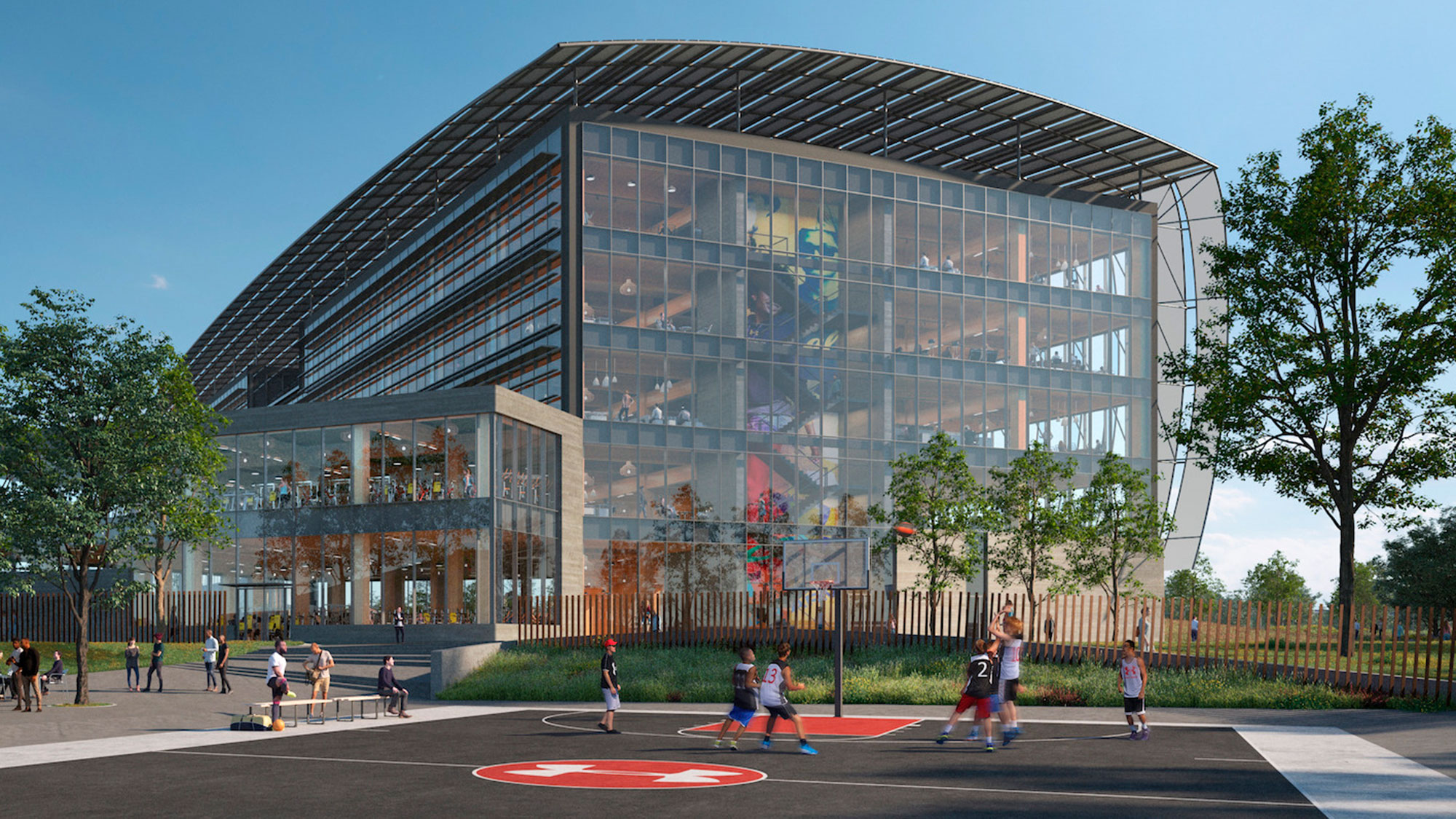 People playing basketball outside Under Armour global headquarters.