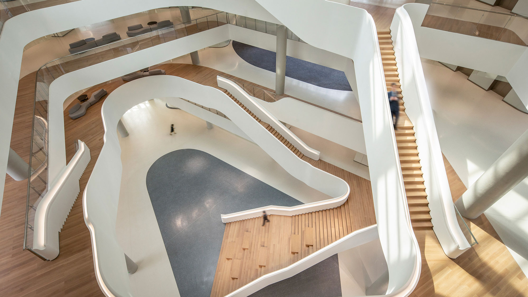 A spiral staircase with white railings.