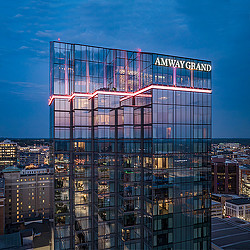 The reflective skyline of Amway Grand Plaza Hotel in Grand Rapids at night