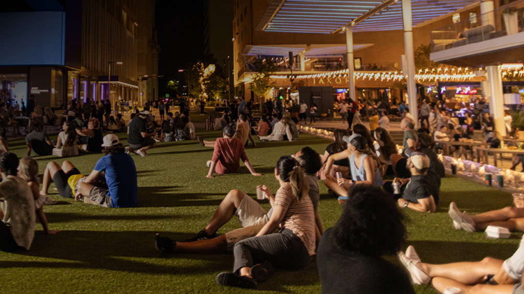 People gathered on AT&T Discovery District lawn