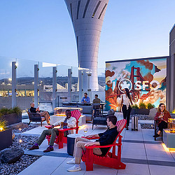 A group of people sitting outside.