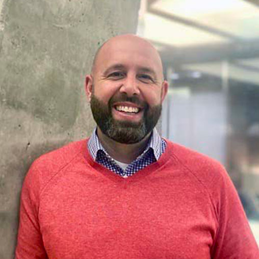 A man smiling for the camera.