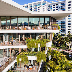 A building with a courtyard and trees.