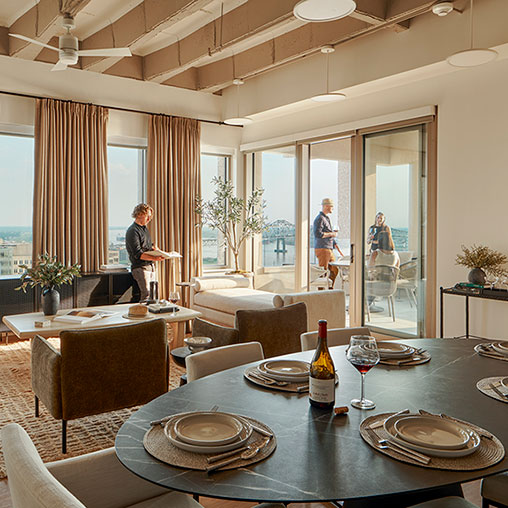 A dining room with a table and chairs.