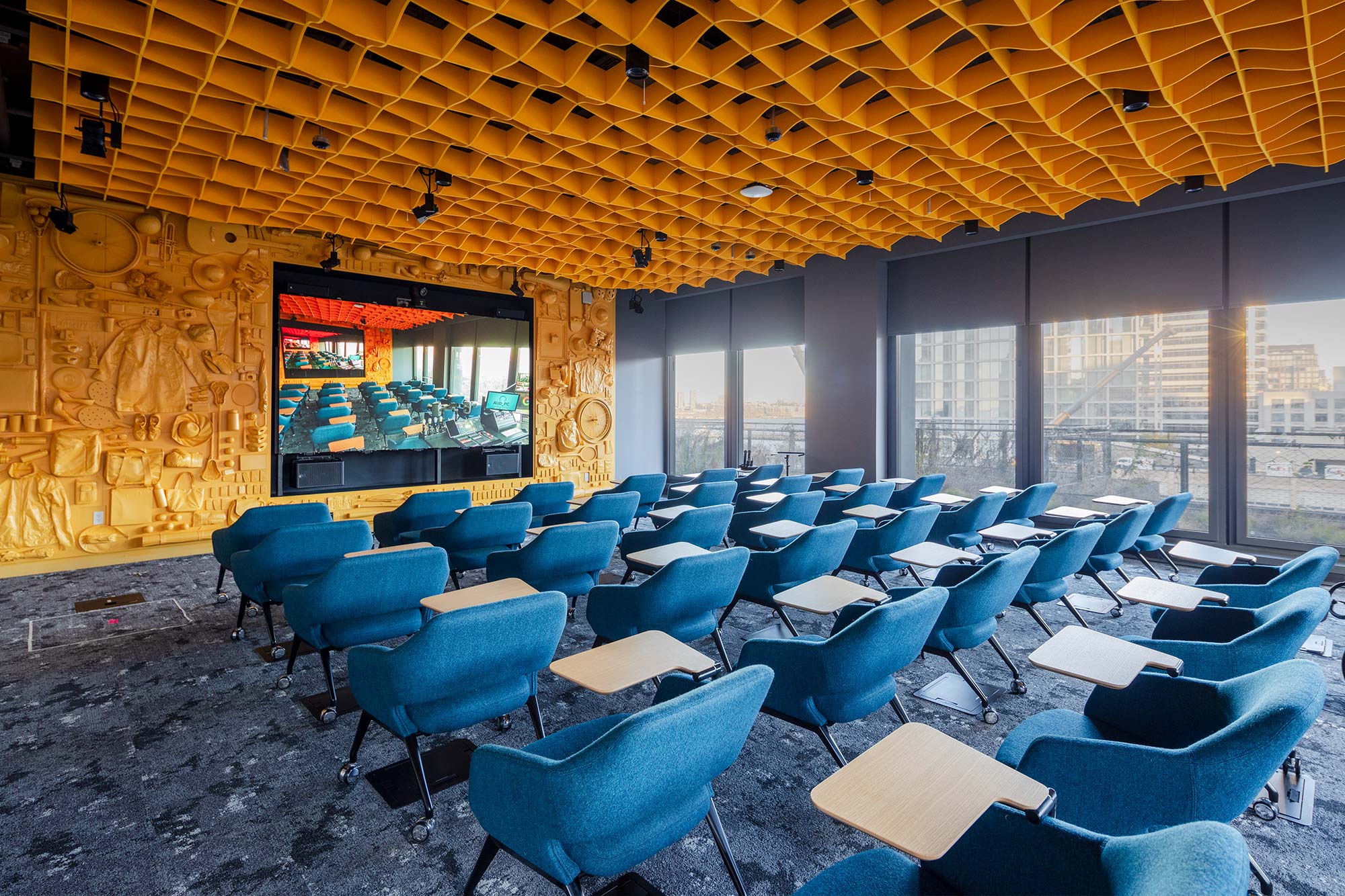 St. John's Terminal Google’s Global Business Organization meeting room with rows of blue chair desks