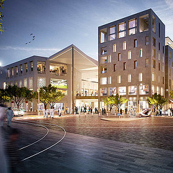 A courtyard with people and buildings around it.