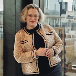 A woman with her arms crossed.