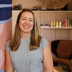 A woman smiling at the camera.