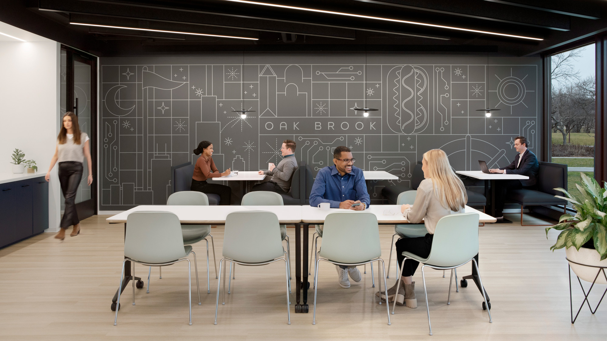 A group of people sitting around a table.