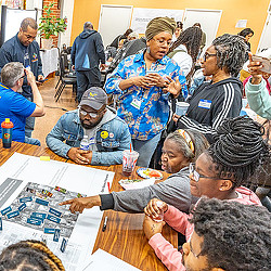 A group of people sitting at a table.