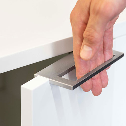 A hand holding a tablet.