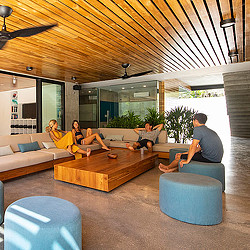 A group of people sitting on couches in a living room.