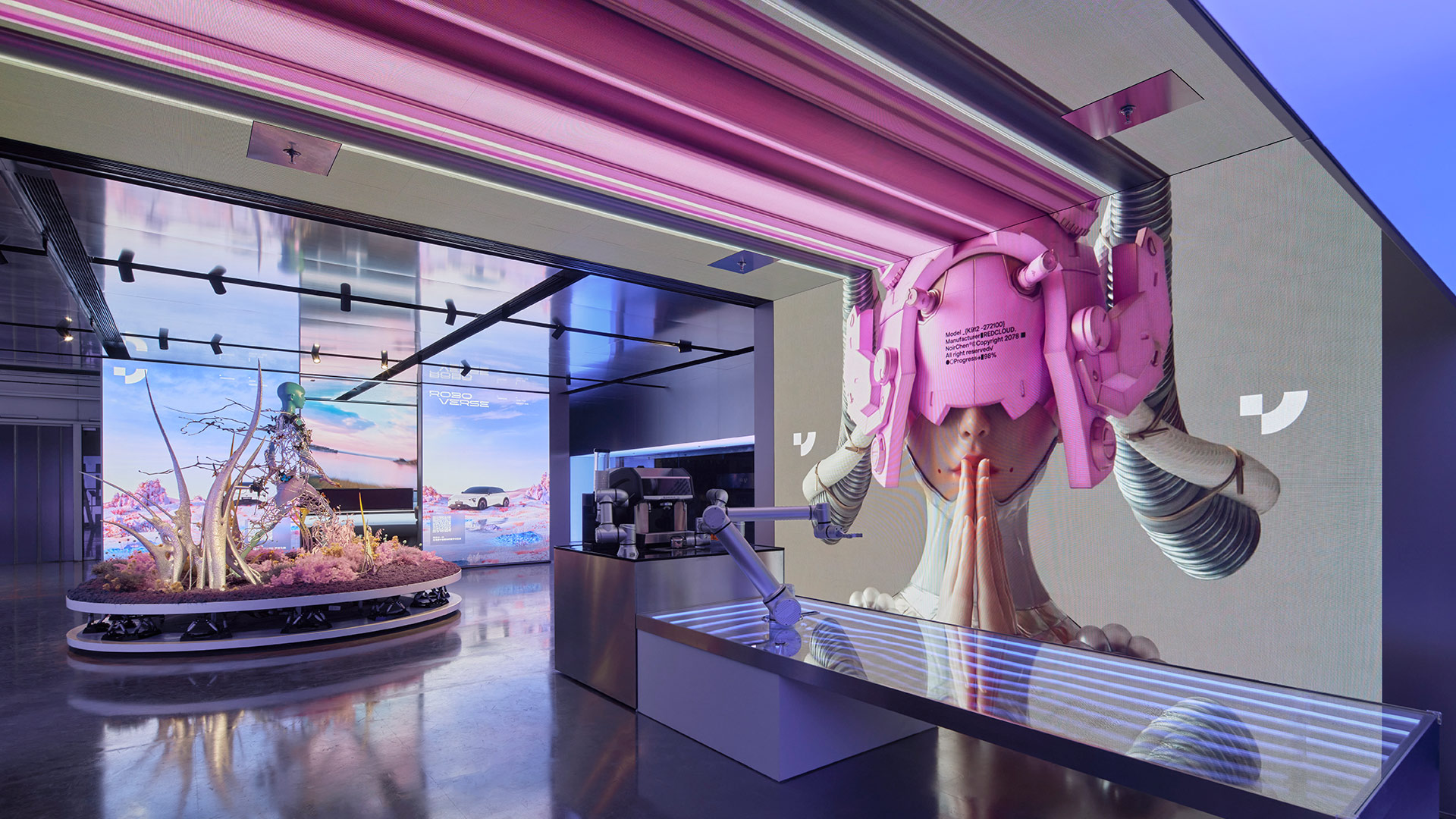 A person wearing a pink hat and a pink wig in a room with a large aquarium.