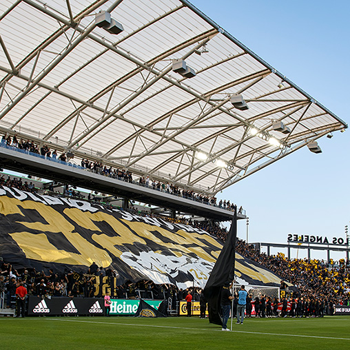 A large crowd of people in a stadium.