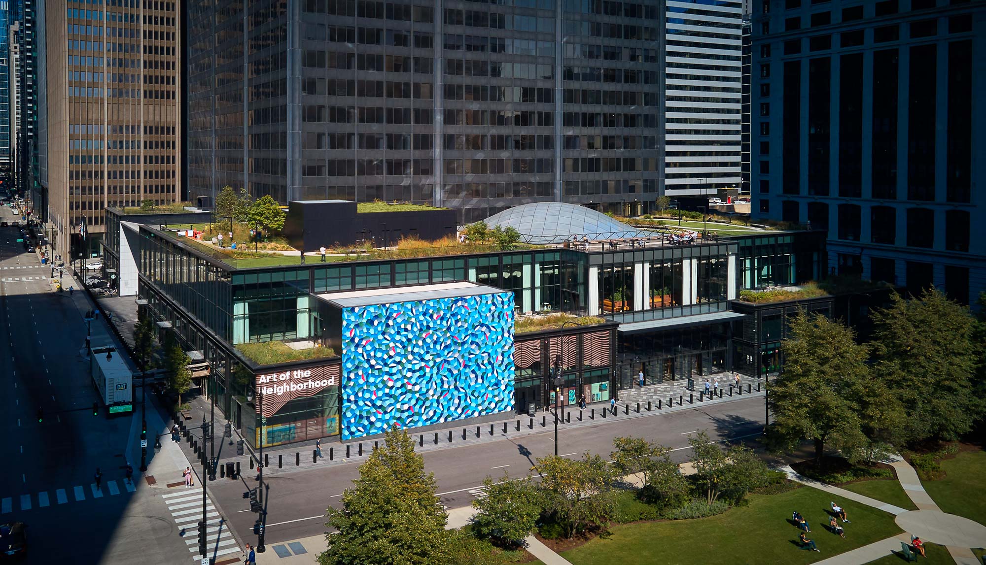 A large building with a blue screen.