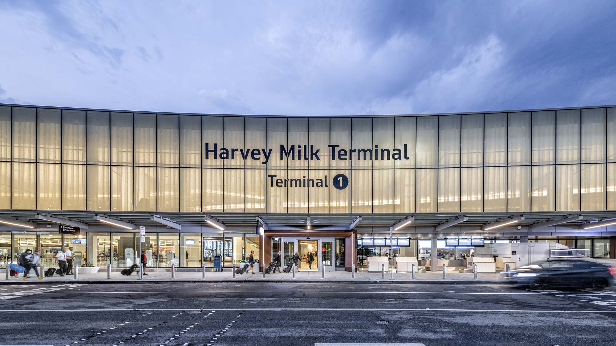 A large building with a parking lot.