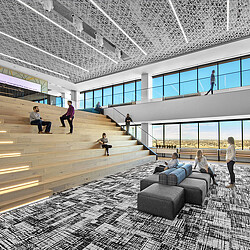 A group of people in a large room with windows and a large glass wall.