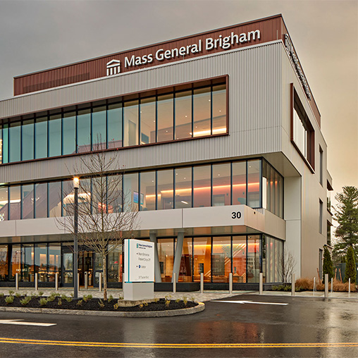 A building with a sign in front.