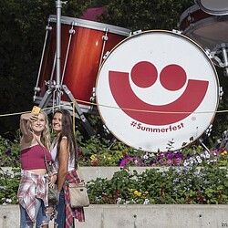 Two women posing for a picture at Summerfest